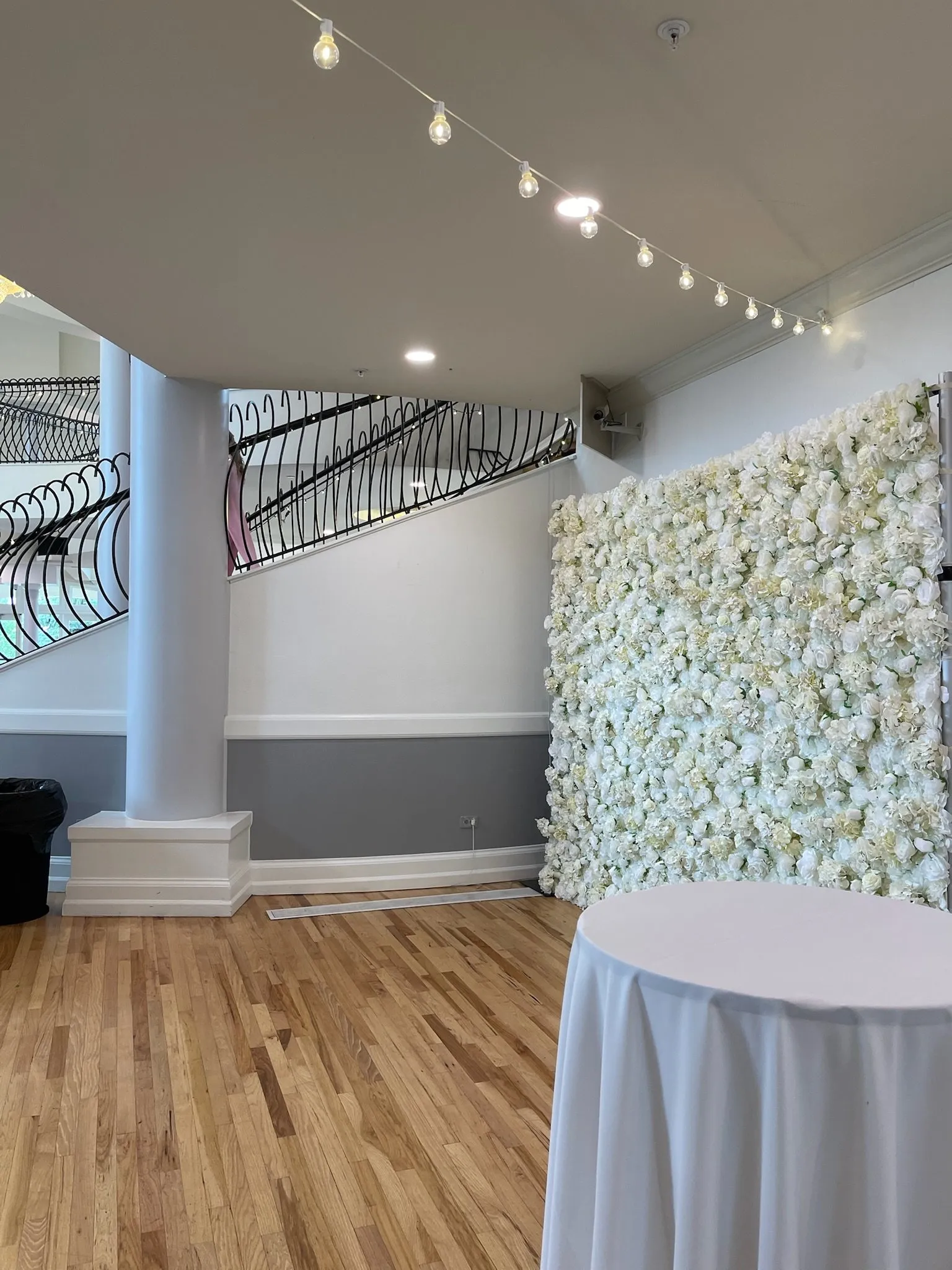 Flower wall set up indoors in a bright event space